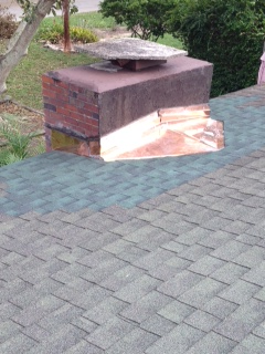 Fabricated a new copper cricket behind chimney. Fabricated a new copper cricket behind chimney.